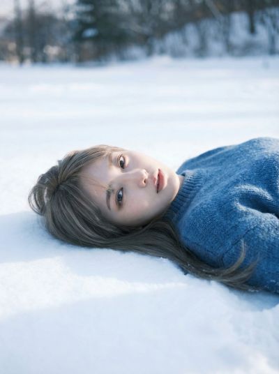 Snow Field Blue Sweater Girl Lying Portrait