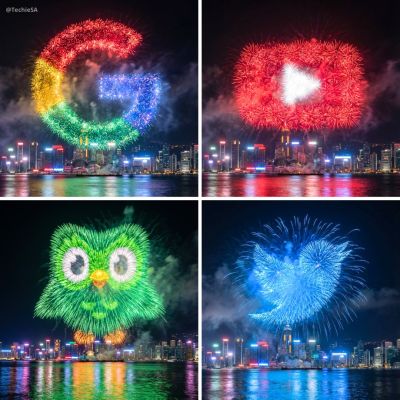 Logo Shaped Fireworks Over A Waterfront City